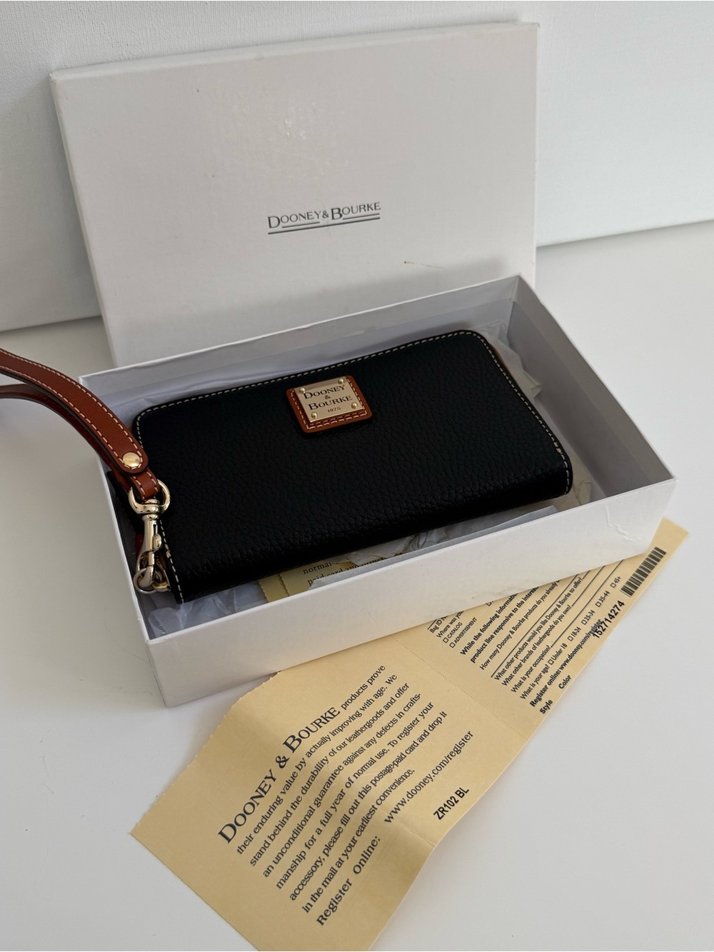 Dooney & Bourke Black Leather Zip Wristlet with Brown Strap